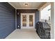 Covered outdoor patio features a concrete floor, gas grill, and entry through glass doors at 8138 Annsborough Nw Dr, Concord, NC 28027