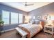 Serene bedroom with neutral walls, wooden bed frame, and window shutters at 824 Broad River Ln, Charlotte, NC 28211