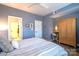 Spacious bedroom with light blue walls and a large wooden armoire at 824 Broad River Ln, Charlotte, NC 28211