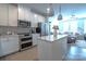 Open concept kitchen featuring island and stainless steel appliances at 824 Broad River Ln, Charlotte, NC 28211