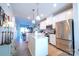 Modern kitchen with stainless steel appliances and white cabinets at 824 Broad River Ln, Charlotte, NC 28211