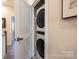 Convenient laundry closet with stackable washer and dryer at 824 Broad River Ln, Charlotte, NC 28211