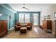 Living area with two leather armchairs, a rug, and wood floors at 824 Broad River Ln, Charlotte, NC 28211