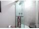 Clean shower with gray tile surround and glass enclosure at 824 Broad River Ln, Charlotte, NC 28211