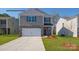 Two-story house with gray siding and a white garage door at 862 Two Brothers Ln, York, SC 29745