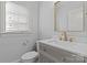 Elegant bathroom with a modern vanity and gold fixtures at 8904 Clavemorr Glenn Ct, Charlotte, NC 28226