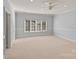 Spacious bedroom with light walls and neutral carpeting at 8904 Clavemorr Glenn Ct, Charlotte, NC 28226