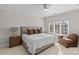 Relaxing bedroom with a comfortable sitting area and large windows at 8904 Clavemorr Glenn Ct, Charlotte, NC 28226