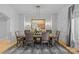 Elegant dining room with hardwood floors and a large, formal dining table at 8904 Clavemorr Glenn Ct, Charlotte, NC 28226