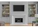 Modern fireplace with built-in shelving, offering a stylish focal point at 8904 Clavemorr Glenn Ct, Charlotte, NC 28226