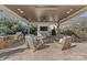 Covered patio with an outdoor kitchen and seating area at 8904 Clavemorr Glenn Ct, Charlotte, NC 28226