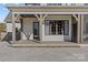 Covered patio with stone flooring and access to the pool at 8904 Clavemorr Glenn Ct, Charlotte, NC 28226