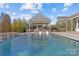 Stunning pool with a spacious patio and water features at 8904 Clavemorr Glenn Ct, Charlotte, NC 28226