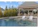 Inviting pool with a spa and covered patio area at 8904 Clavemorr Glenn Ct, Charlotte, NC 28226