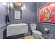 Elegant powder room with marble vanity and modern fixtures at 8904 Clavemorr Glenn Ct, Charlotte, NC 28226