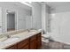 Bathroom boasts double sinks and a shower/tub combo at 1010 Craven St, Indian Trail, NC 28079