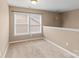 Simple bedroom with carpet and two windows at 1010 Craven St, Indian Trail, NC 28079