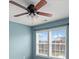 Light blue bedroom with ceiling fan and two windows at 1010 Craven St, Indian Trail, NC 28079