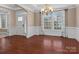 Formal dining room with hardwood floors, crown molding, and a chandelier at 1010 Craven St, Indian Trail, NC 28079