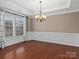 Formal dining room with hardwood floors, crown molding, and a chandelier at 1010 Craven St, Indian Trail, NC 28079
