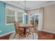 Charming dining room with wood table and slider to backyard at 1010 Craven St, Indian Trail, NC 28079