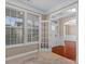 Bright office with hardwood floors, built-in shelving, and French doors at 1010 Craven St, Indian Trail, NC 28079
