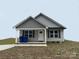 Gray vinyl-sided house with a small front porch at 103 Harley St, Wadesboro, NC 28170