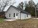 Rear view of gray house, showing a small patio at 103 Harley St, Wadesboro, NC 28170