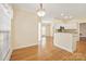 Spacious dining room with hardwood floors and kitchen view at 11304 Lemmond Acres Dr, Mint Hill, NC 28227