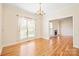 Bright dining room with hardwood floors and chandelier at 11304 Lemmond Acres Dr, Mint Hill, NC 28227