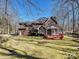 Brick house with screened porch and deck, wooded setting at 1201 Over Stream Ln, Matthews, NC 28105