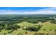 Aerial view showcasing the property's extensive land at 1318 Ostwalt Amity Rd, Cleveland, NC 27013