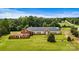 Aerial view of a large brick building on a plot of land at 1318 Ostwalt Amity Rd, Cleveland, NC 27013