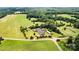 Wide shot of the property and surrounding land at 1318 Ostwalt Amity Rd, Cleveland, NC 27013
