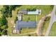 Aerial view of property showing main building and outbuildings at 1318 Ostwalt Amity Rd, Cleveland, NC 27013