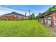 Brick building with grassy area and attached garage at 1318 Ostwalt Amity Rd, Cleveland, NC 27013