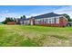 Brick building with large windows and a spacious yard at 1318 Ostwalt Amity Rd, Cleveland, NC 27013