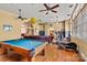 Game room features a pool table, exercise equipment, and hardwood floors at 1318 Ostwalt Amity Rd, Cleveland, NC 27013