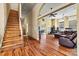 Wood floors, wooden staircase, and a view into living room at 1318 Ostwalt Amity Rd, Cleveland, NC 27013
