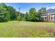 Spacious grassy yard beside brick building at 1318 Ostwalt Amity Rd, Cleveland, NC 27013
