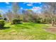 Beautiful green backyard, partially fenced with privacy provided by lush landscaping at 14500 Harvington Dr, Huntersville, NC 28078