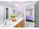 Bathroom with double sink vanity, and a view to the bedroom at 14500 Harvington Dr, Huntersville, NC 28078