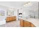Bright bathroom with double sink vanity, ceramic tile floor, soaking tub, and separate shower at 14500 Harvington Dr, Huntersville, NC 28078