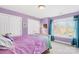 Bedroom featuring neutral carpet and paint, two closets, and a large window at 14500 Harvington Dr, Huntersville, NC 28078