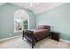 Bedroom with vaulted ceiling, large window, neutral carpet and walls at 14500 Harvington Dr, Huntersville, NC 28078