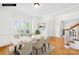 Elegant dining room boasting natural light, hardwood floors, and modern decor at 14500 Harvington Dr, Huntersville, NC 28078