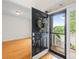 Inviting entryway with hardwood floors and a view of the outdoors through a decorative door at 14500 Harvington Dr, Huntersville, NC 28078