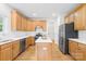 Bright kitchen with stainless steel appliances, light wood cabinetry, and a center island at 14500 Harvington Dr, Huntersville, NC 28078