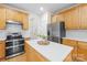 Well-appointed kitchen featuring an island with countertop space and modern appliances at 14500 Harvington Dr, Huntersville, NC 28078