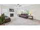 Bright and airy living room featuring a fireplace, plush couches, and plenty of natural light at 14500 Harvington Dr, Huntersville, NC 28078